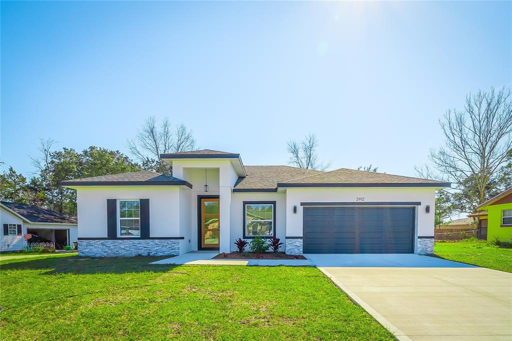 front view of a house with a yard