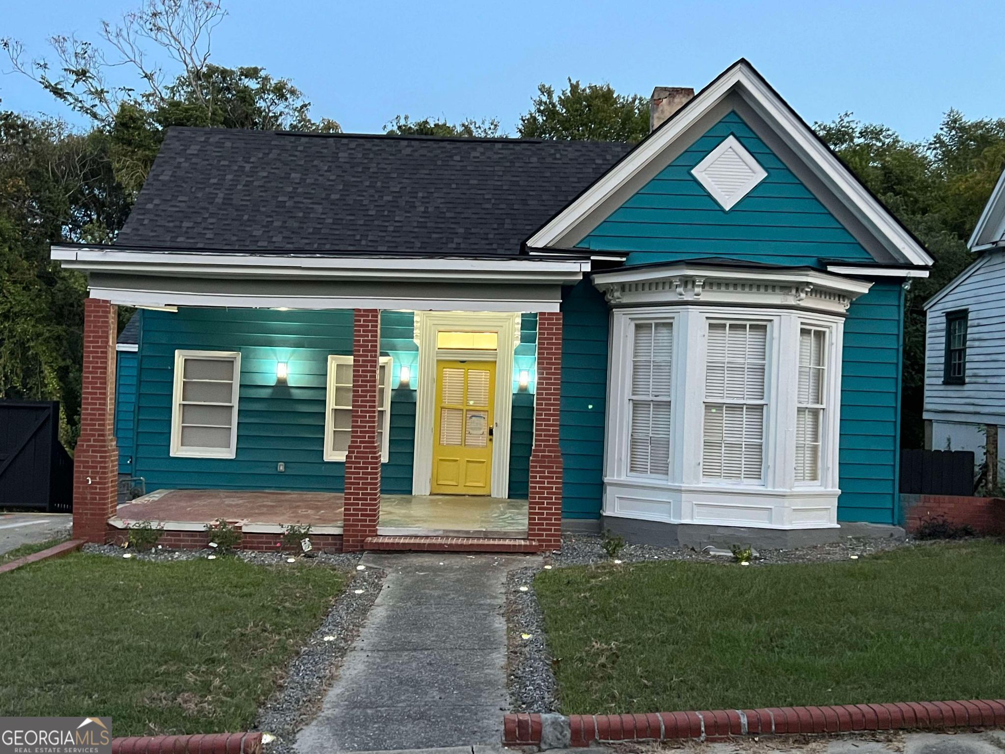 front view of a house with a yard