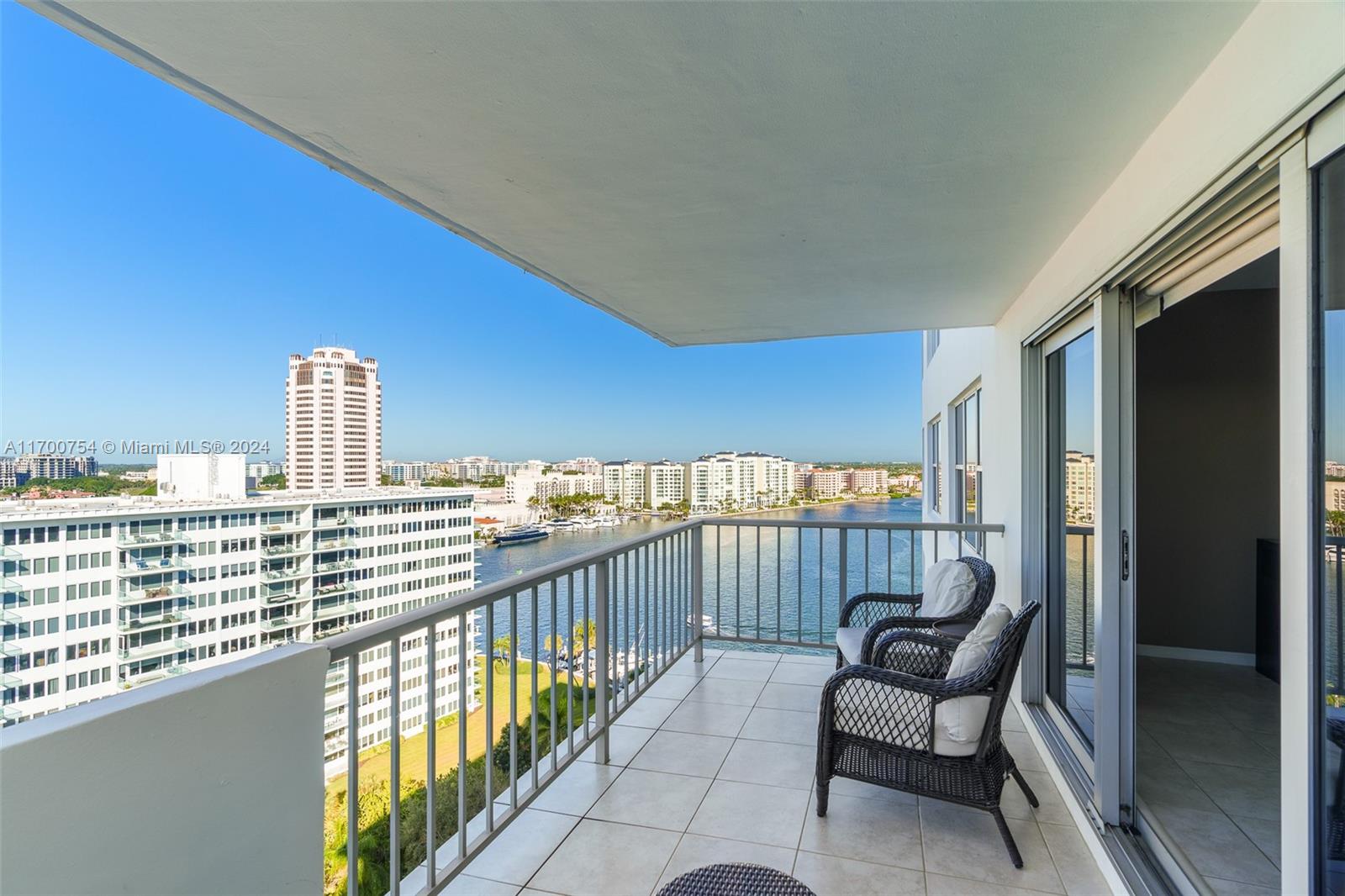 a view of a balcony with furniture