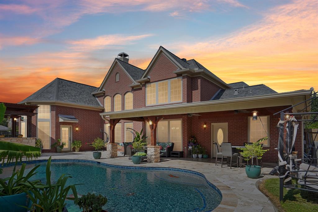 a front view of house with yard and outdoor seating