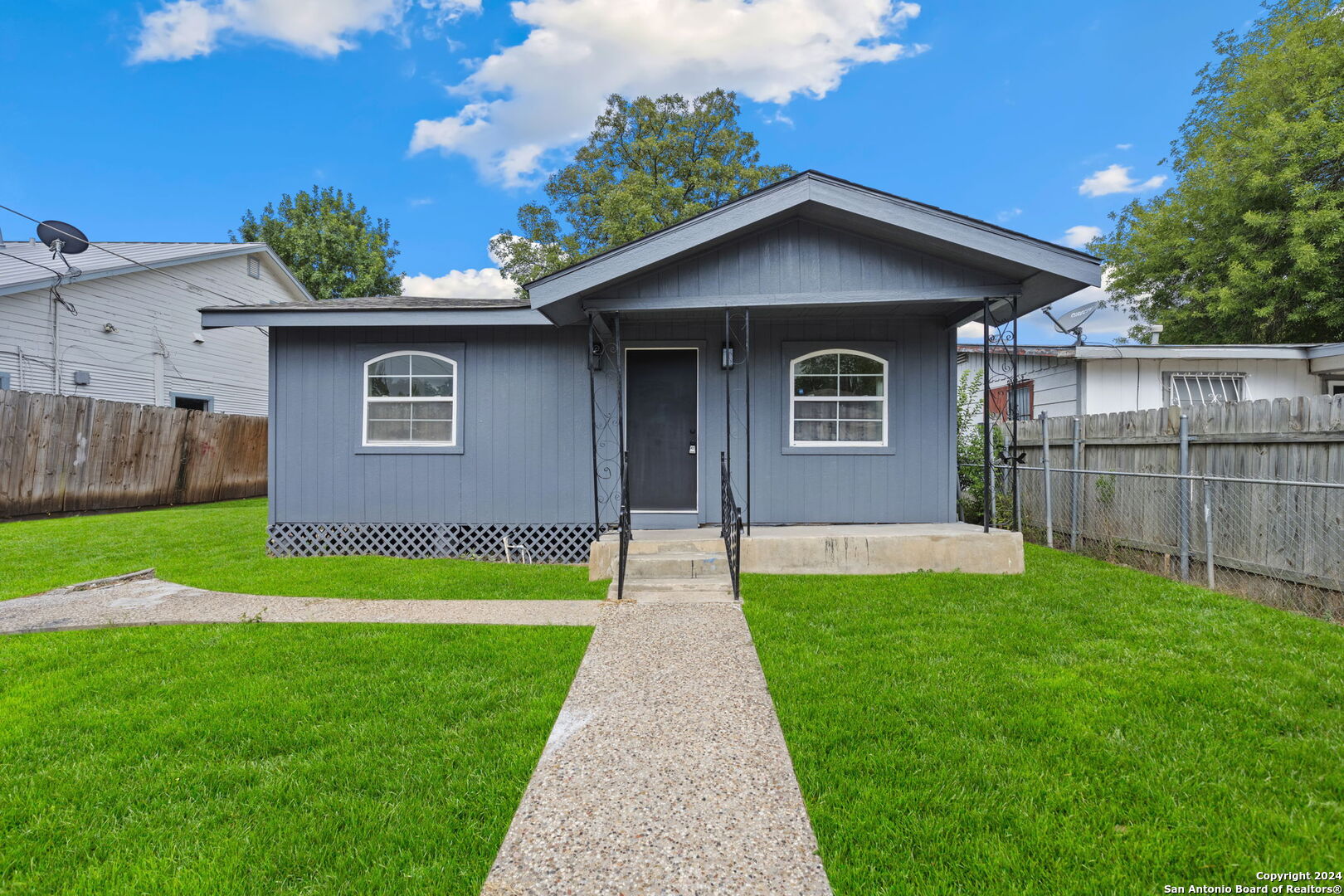 a front view of a house with yard