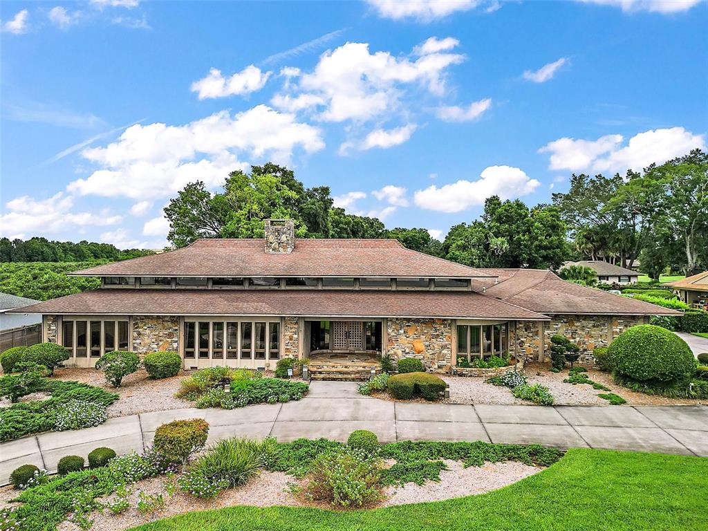 a front view of a house with garden and porch