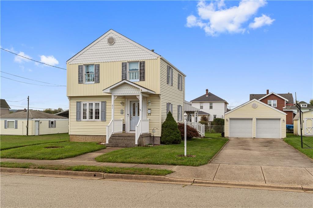 a front view of a house with a yard