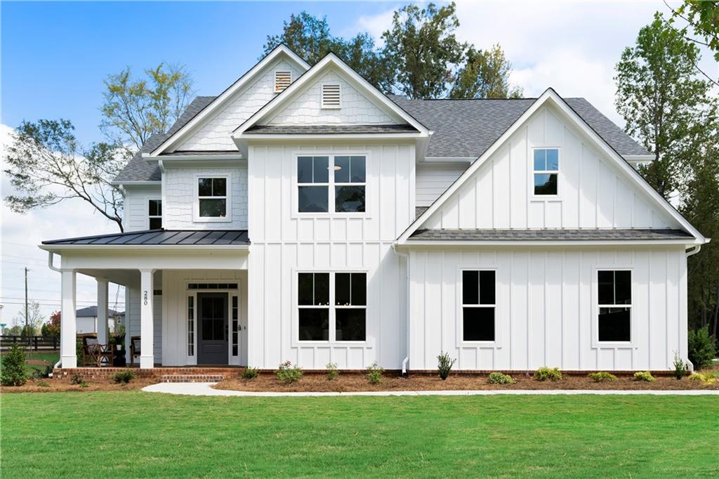 a front view of a house with a yard