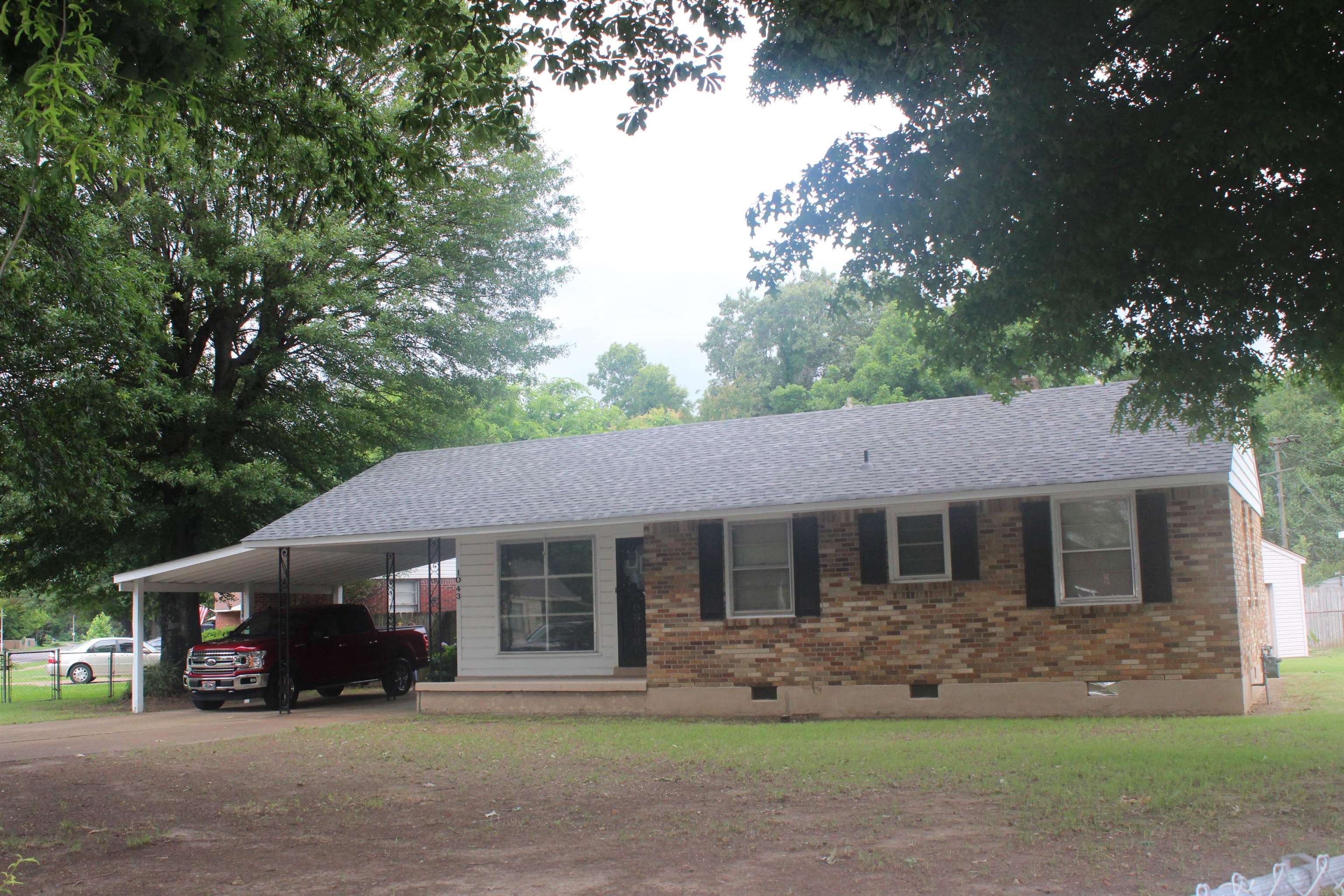 NEW YEARS PRICE! All maintenance free exterior Brick, NEW ROOF and all New Exterior Paint! $17k exterior work done 2023. Fenced, Shop out back with HVAC and a place to hook up gas stove. Original Hardwood Floors in the main house. 1 YEAR HOME WARRANTY!