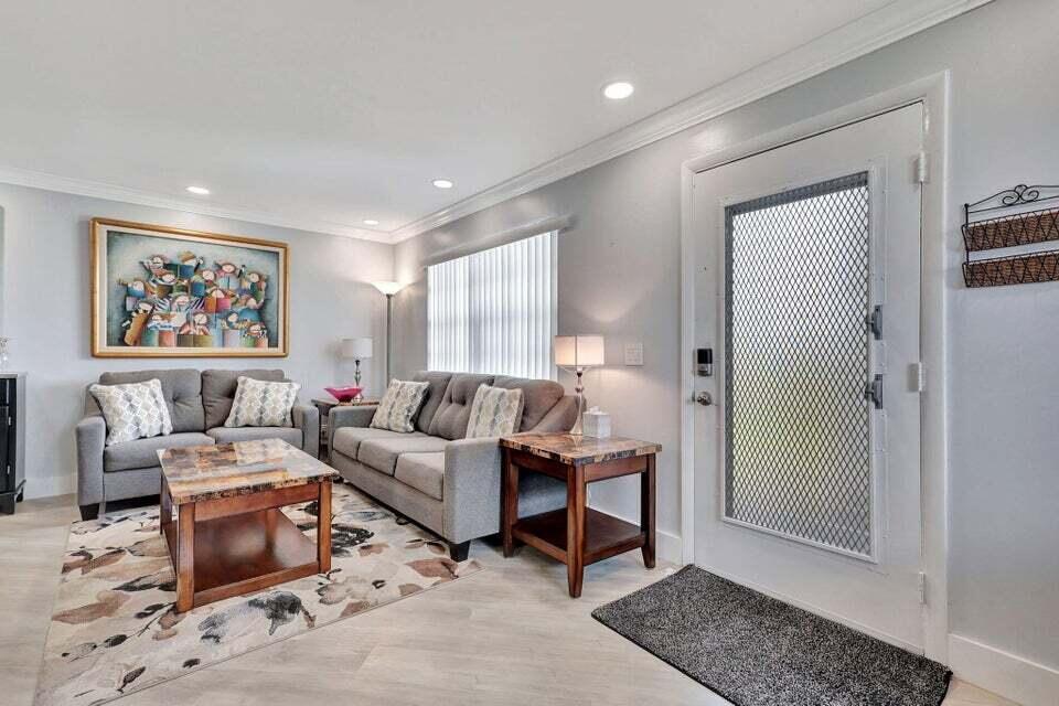 a living room with furniture and a gate