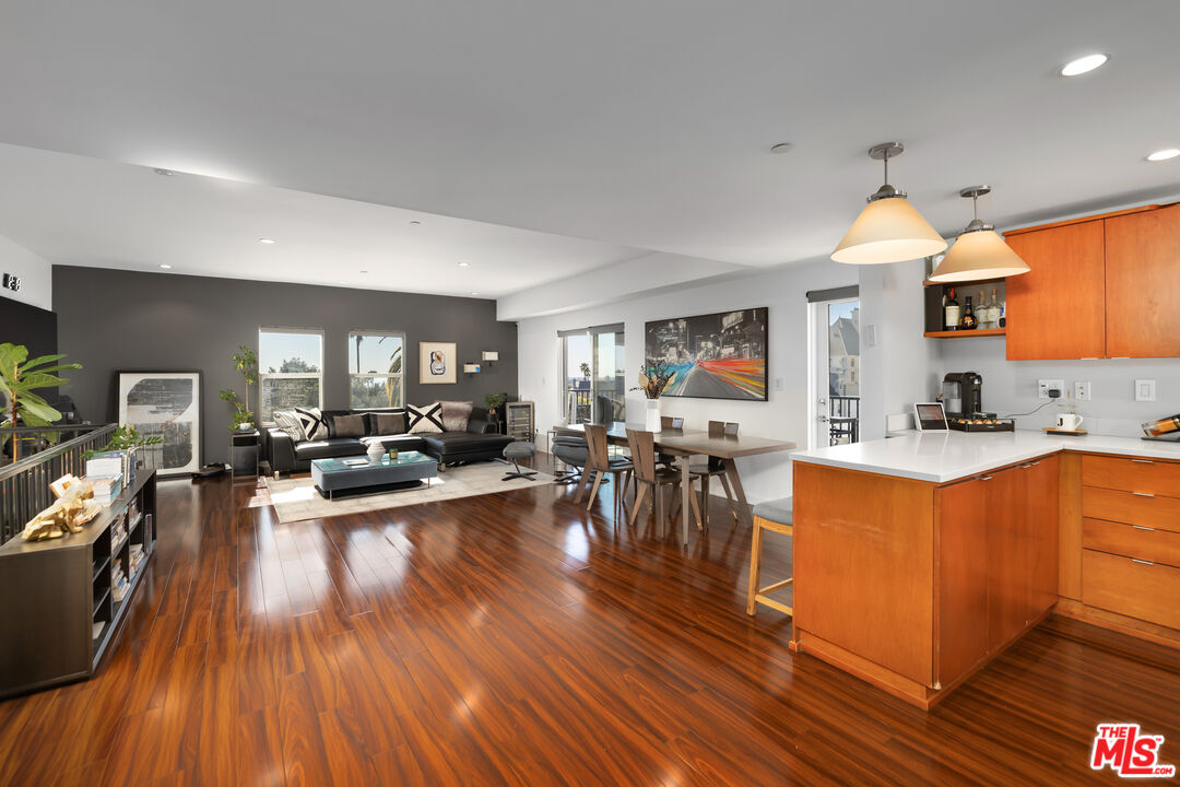 a living room with furniture dining table and a fireplace