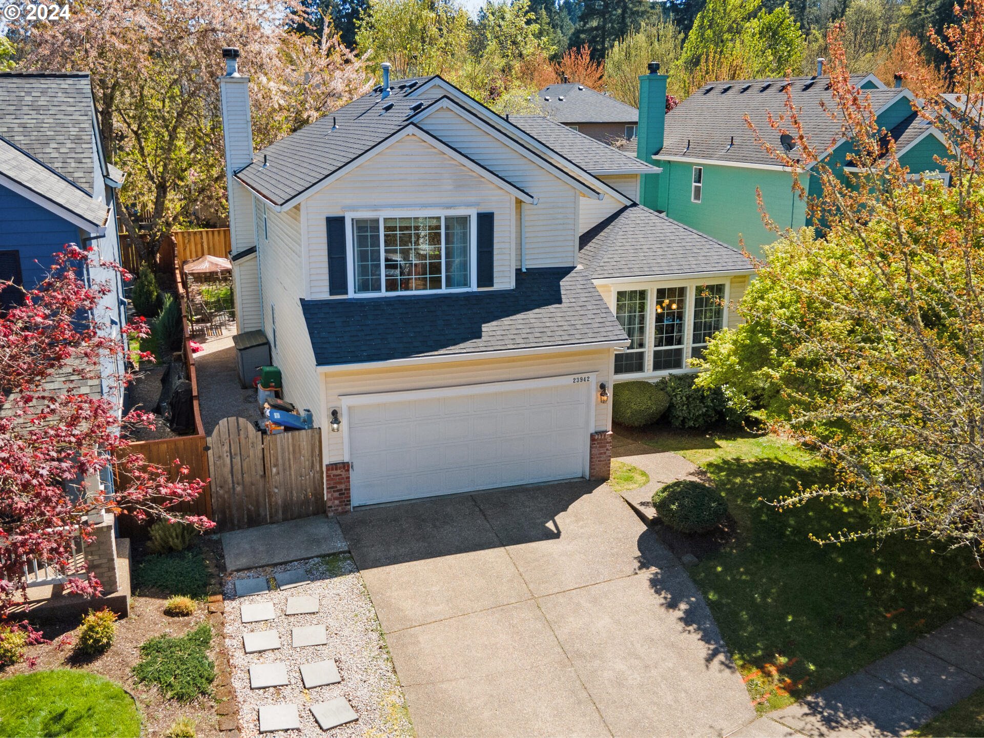 a front view of a house with a garden