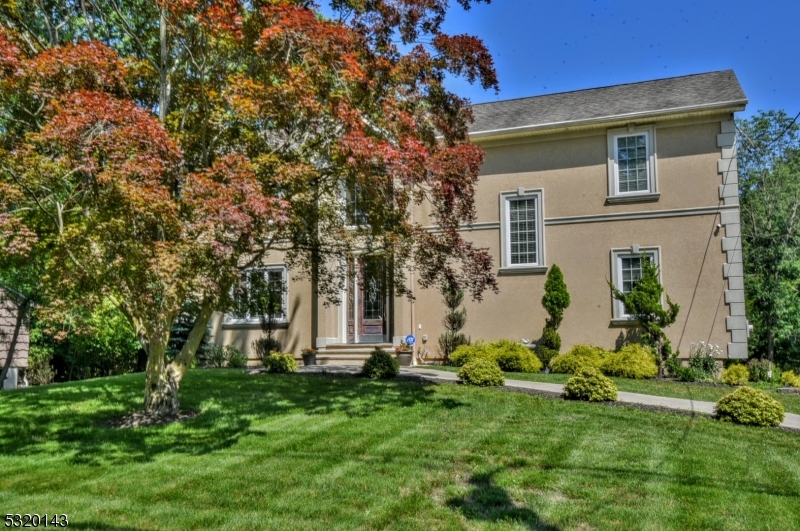 front view of a house with a garden