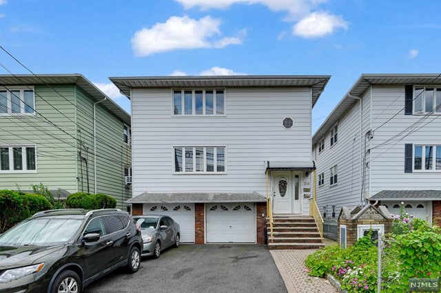 a front view of a house with parking