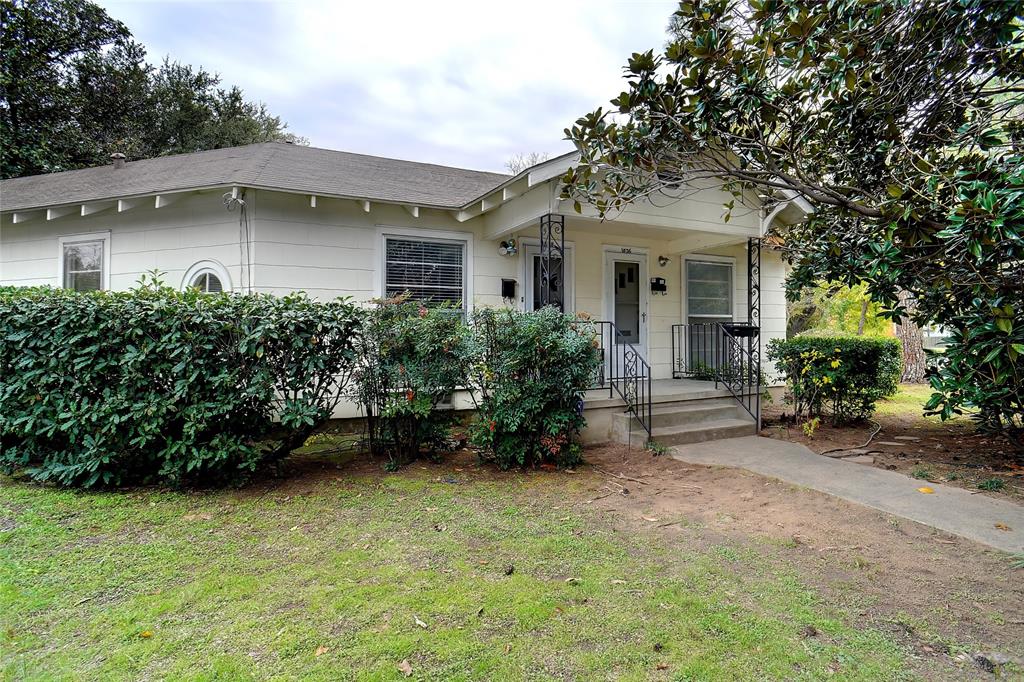 front view of a house with a garden