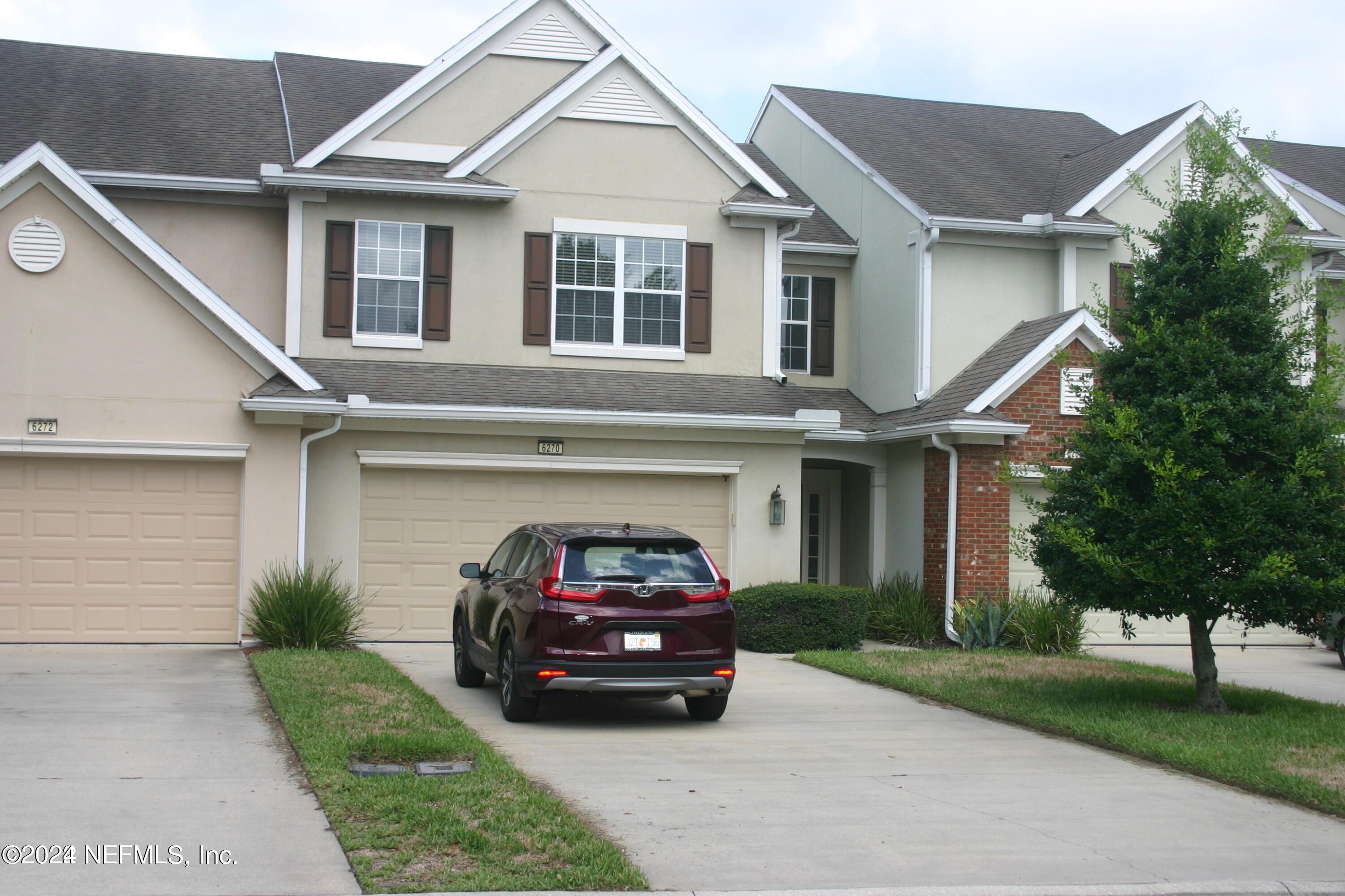 a car parked in front of a house