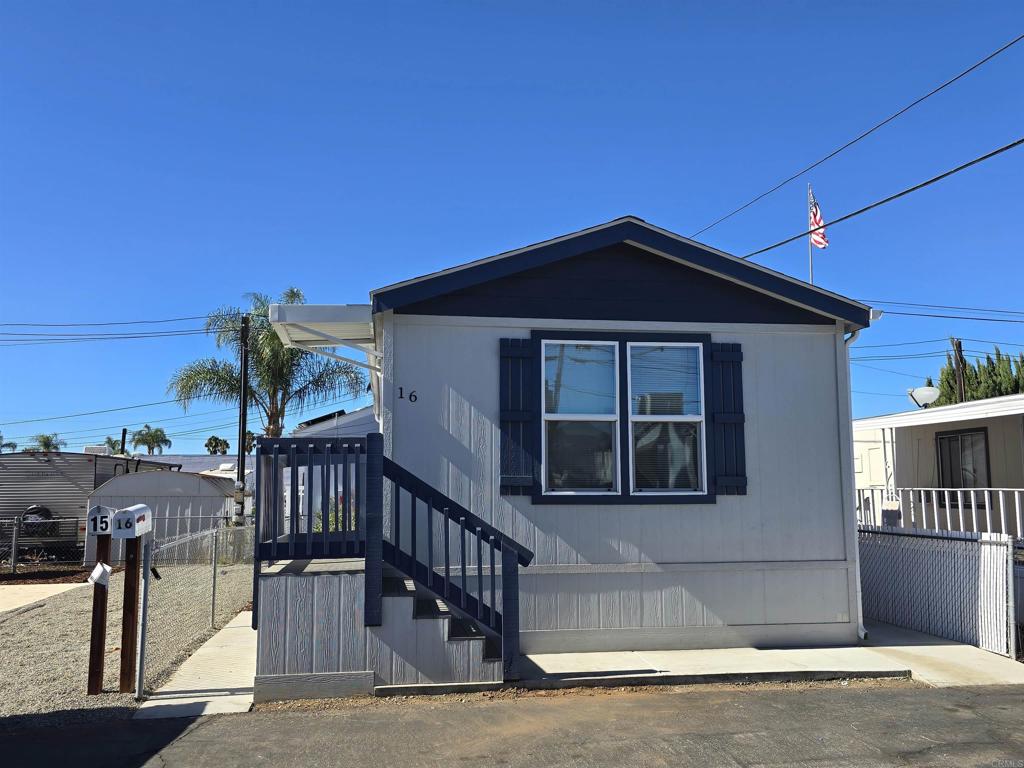 a front view of a house with parking space