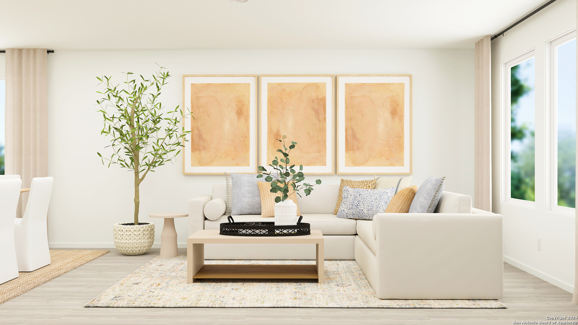 a living room with furniture and a potted plant