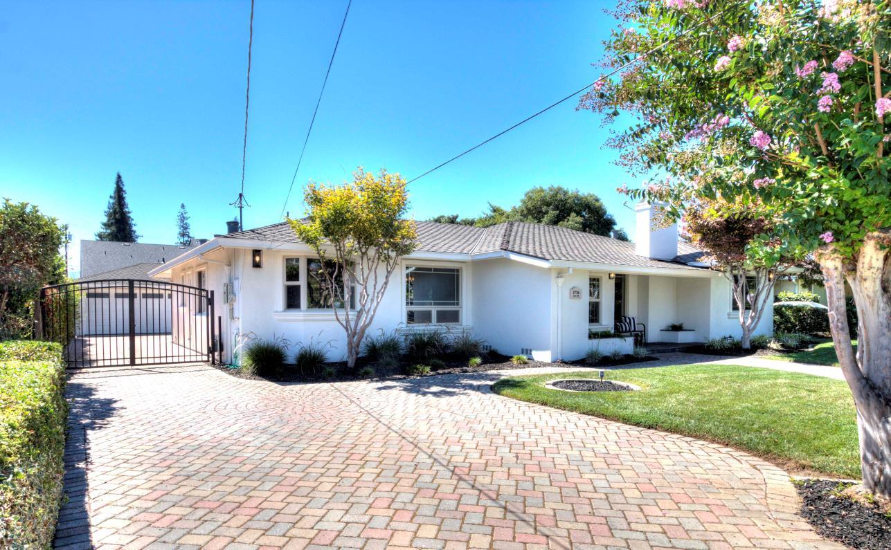 a front view of house with yard outdoor seating and barbeque oven