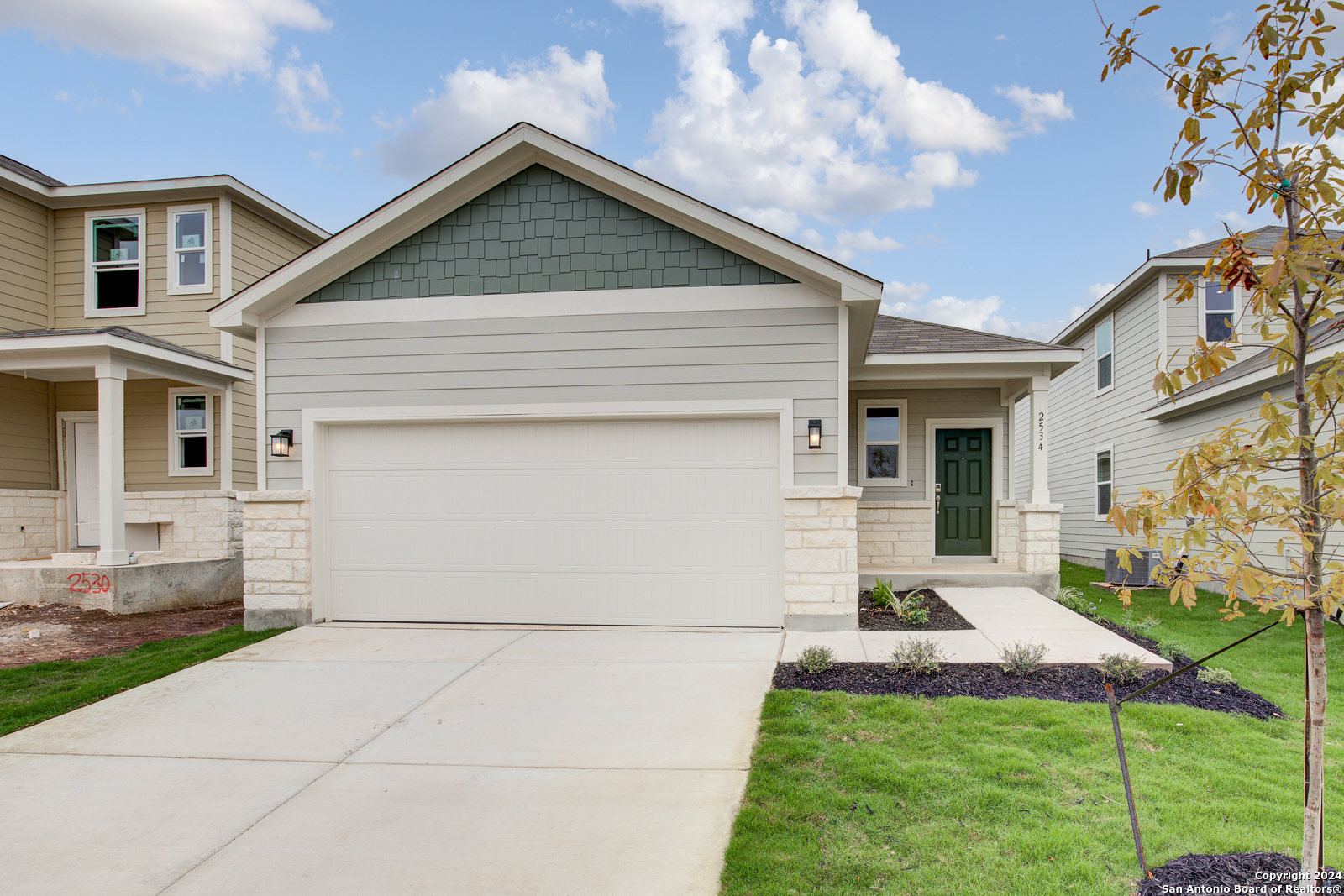 a front view of a house with a yard