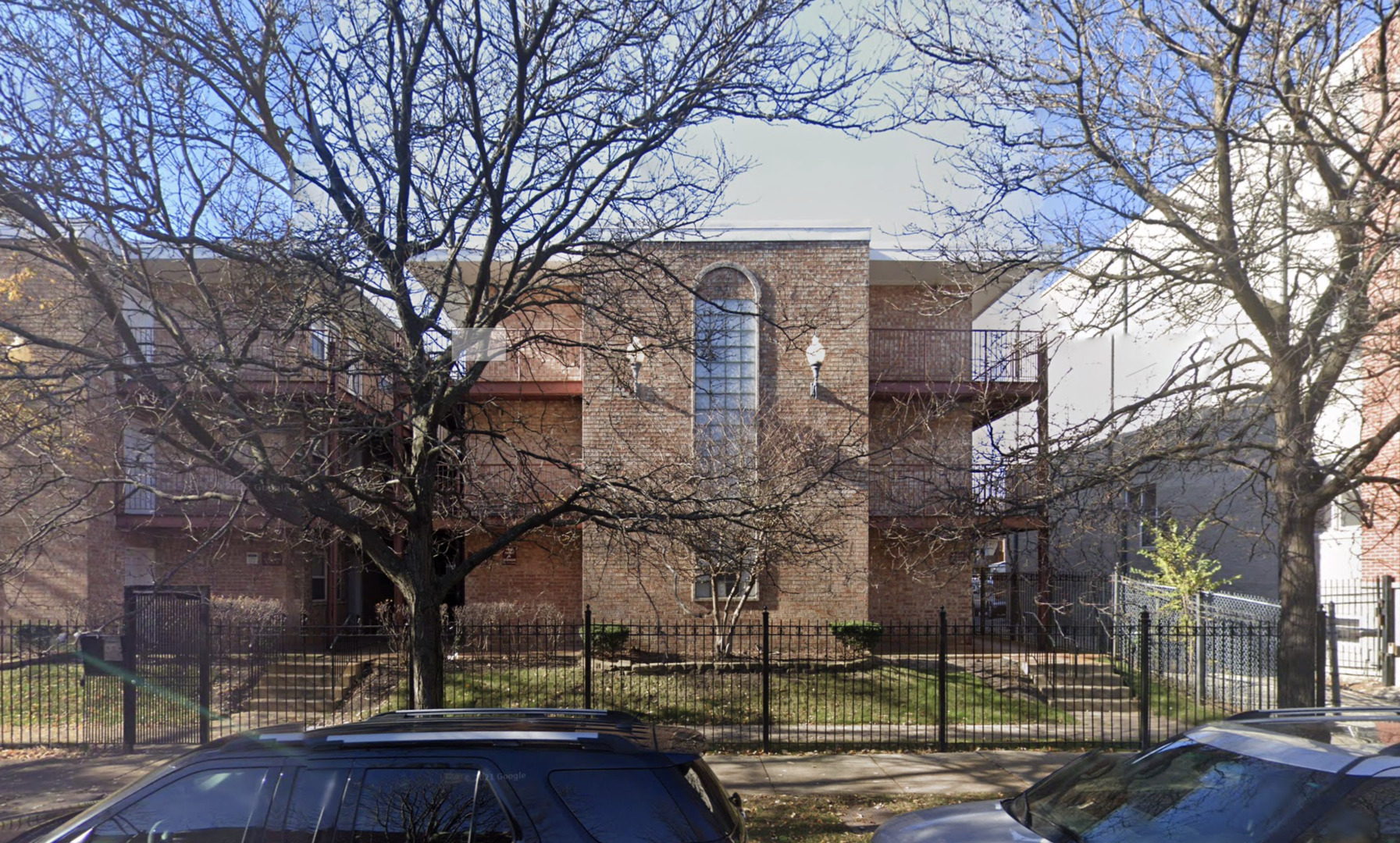 a view of a building with trees