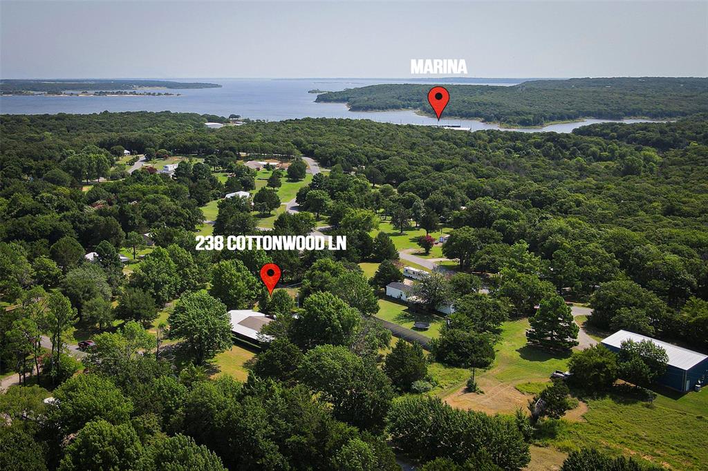 an aerial view of a houses with a yard