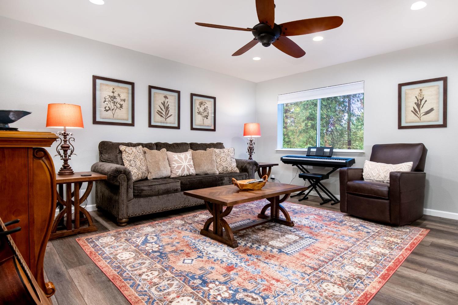 a living room with furniture and a rug