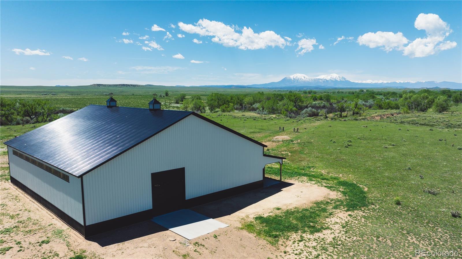 a aerial view of a house with a yard