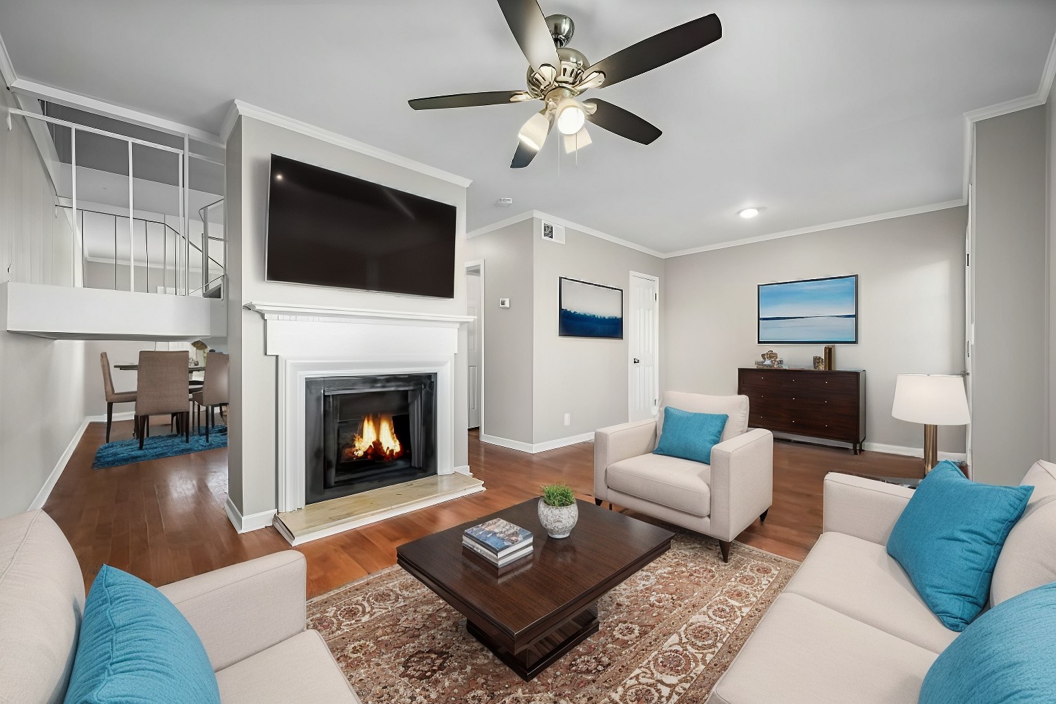 a living room with furniture fireplace and flat screen tv