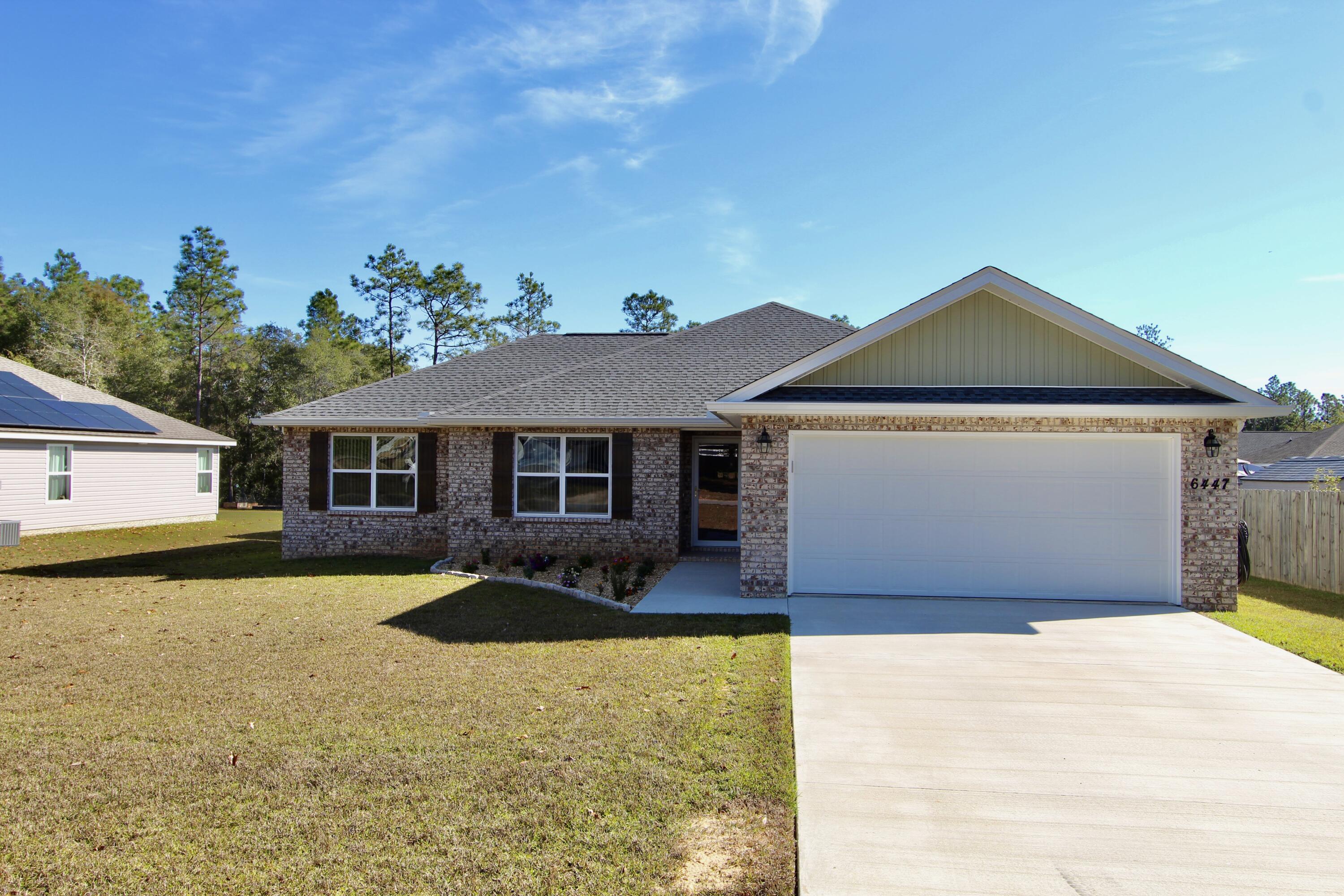 a front view of a house with yard