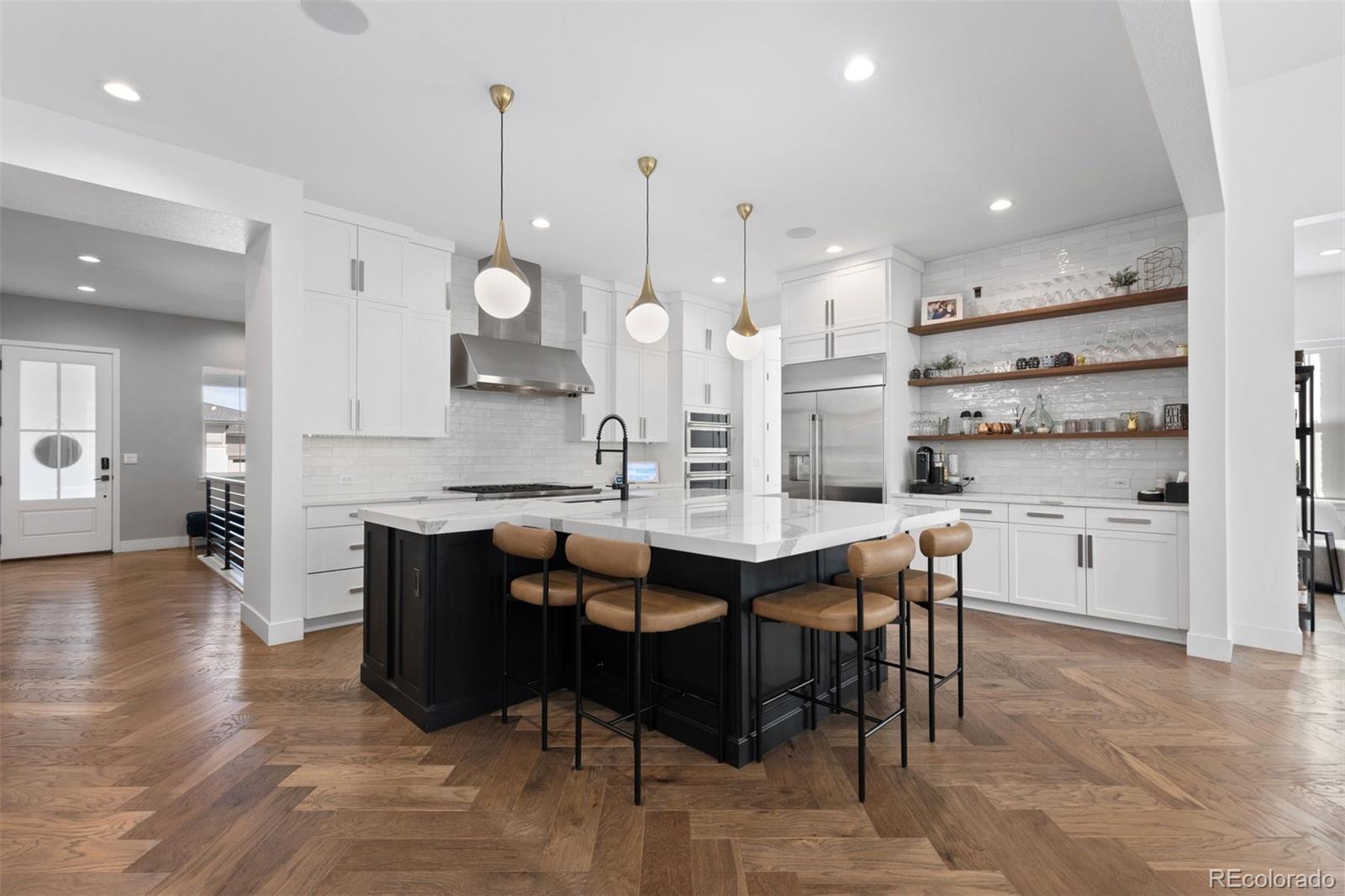 a large kitchen with a table and chairs