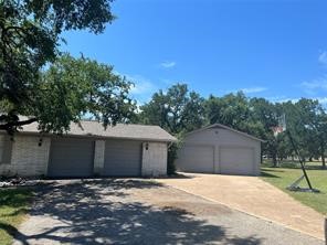 Attached 2-car garage plus detached 2-car garage.