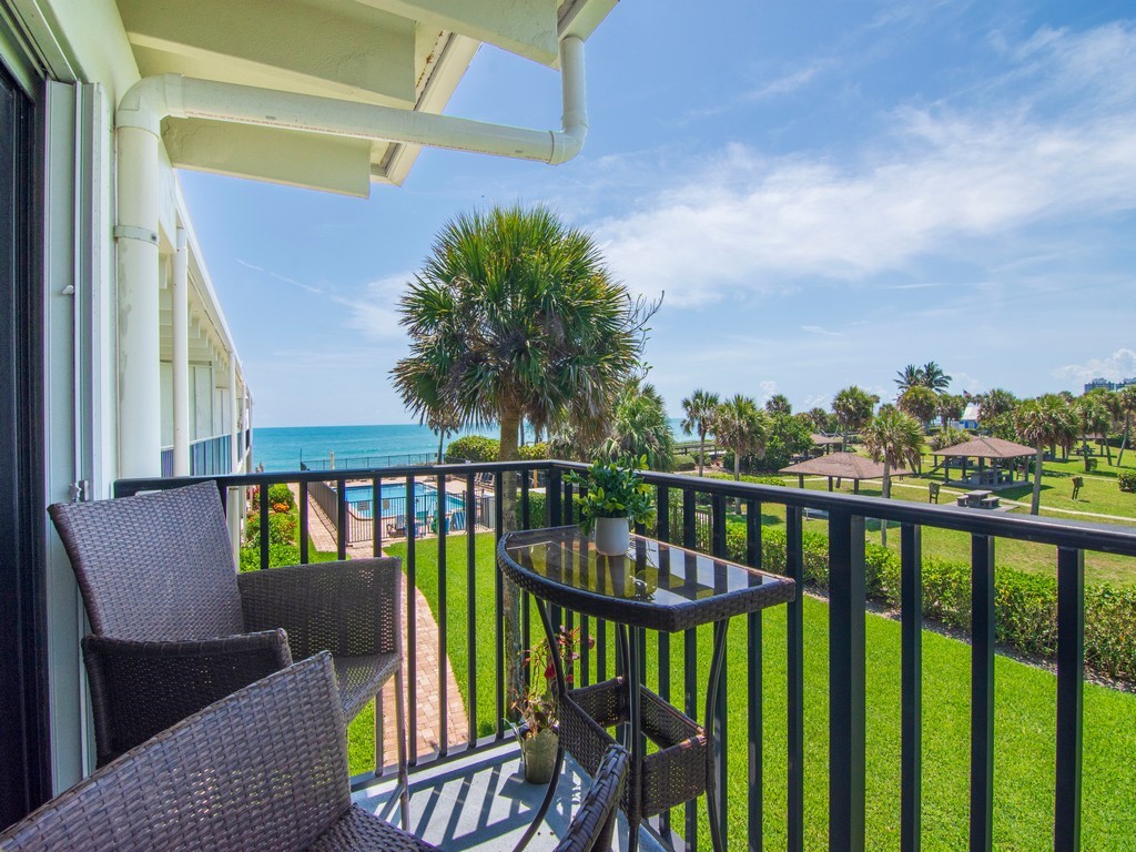 a view of balcony with furniture