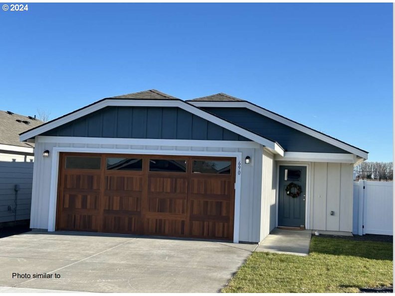 a front view of a house with a garage