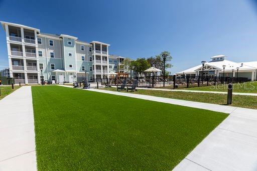 a view of a building with a yard