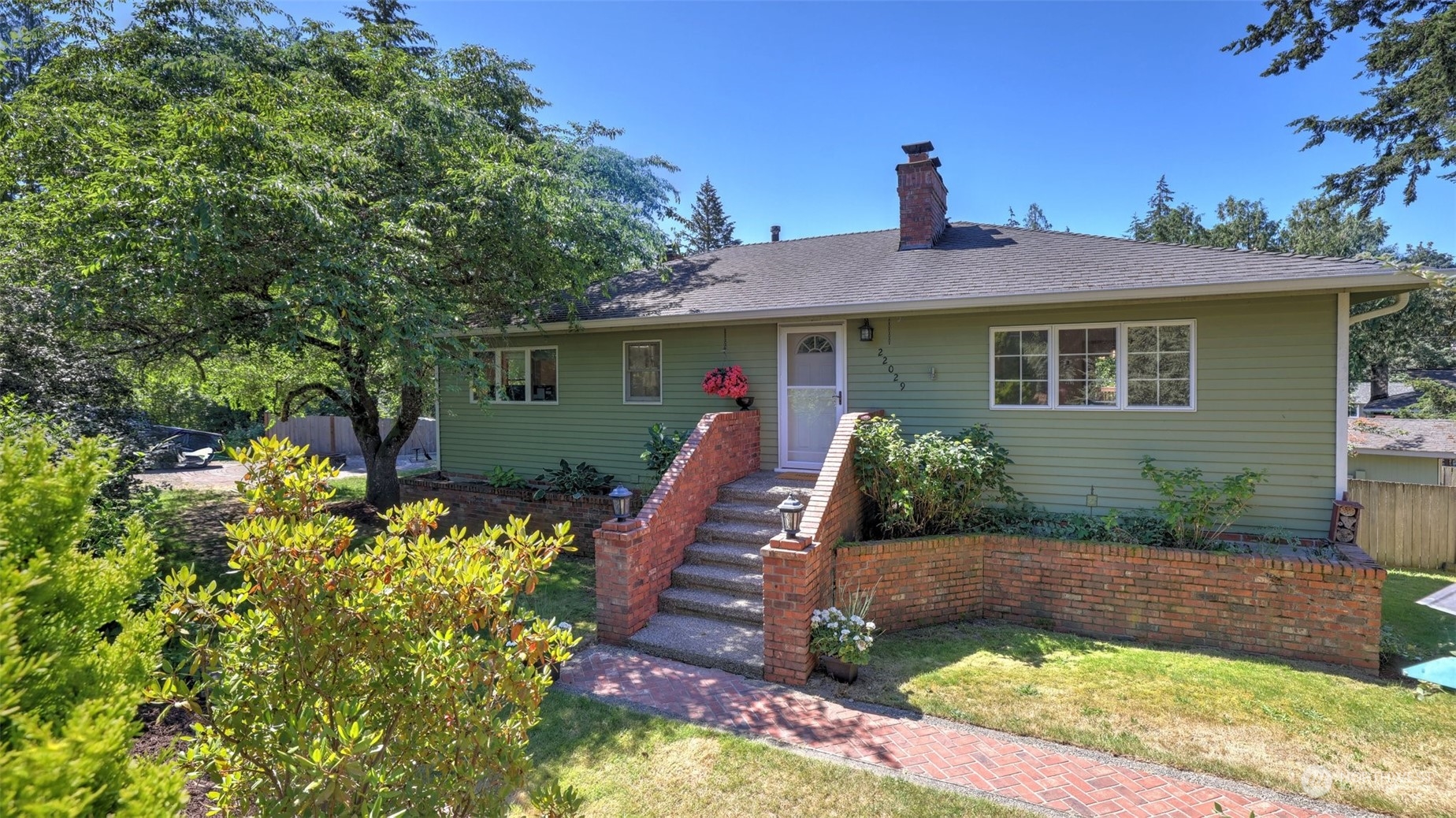 front view of a house with a yard