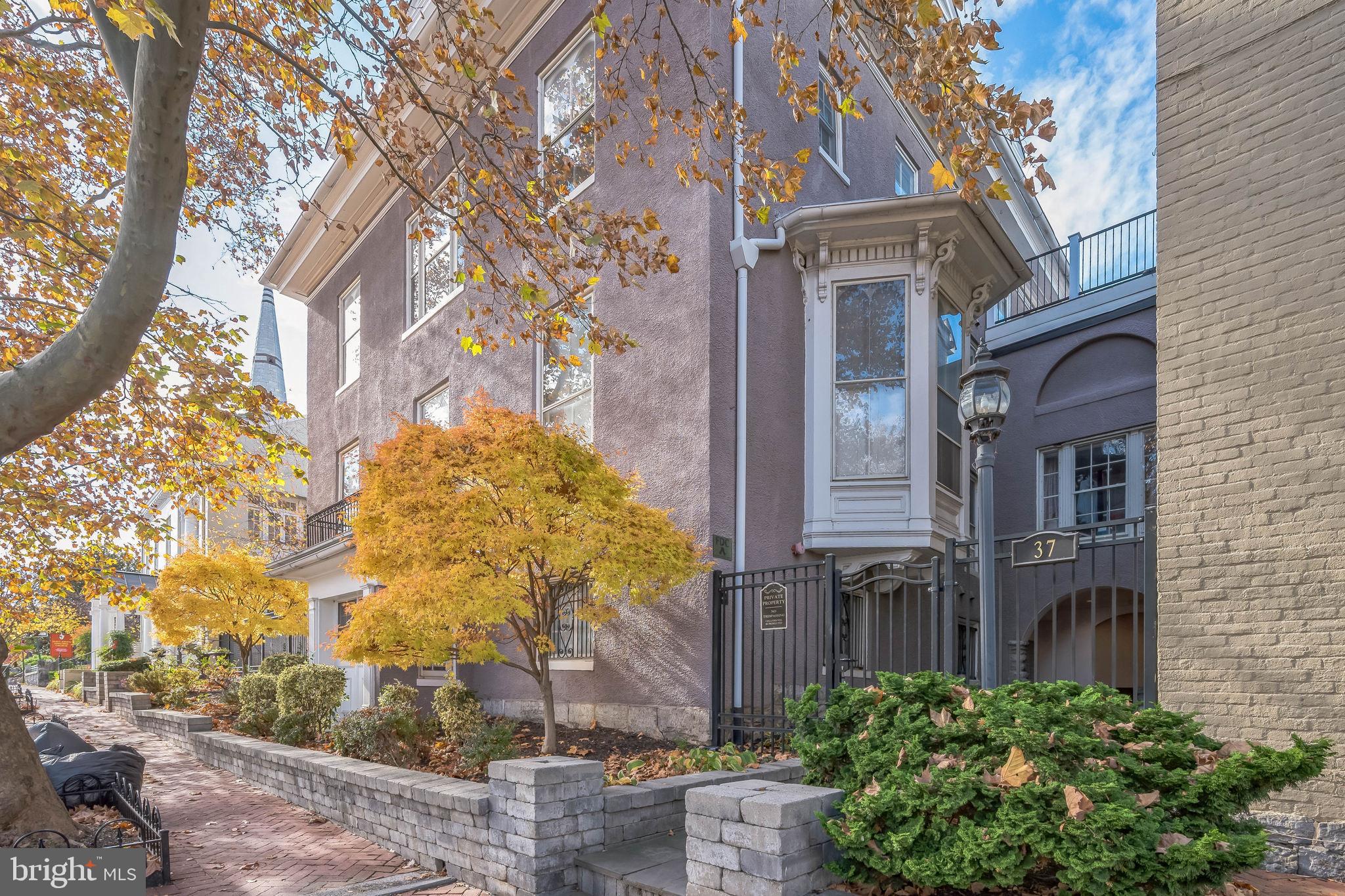 a view of a house with a tree