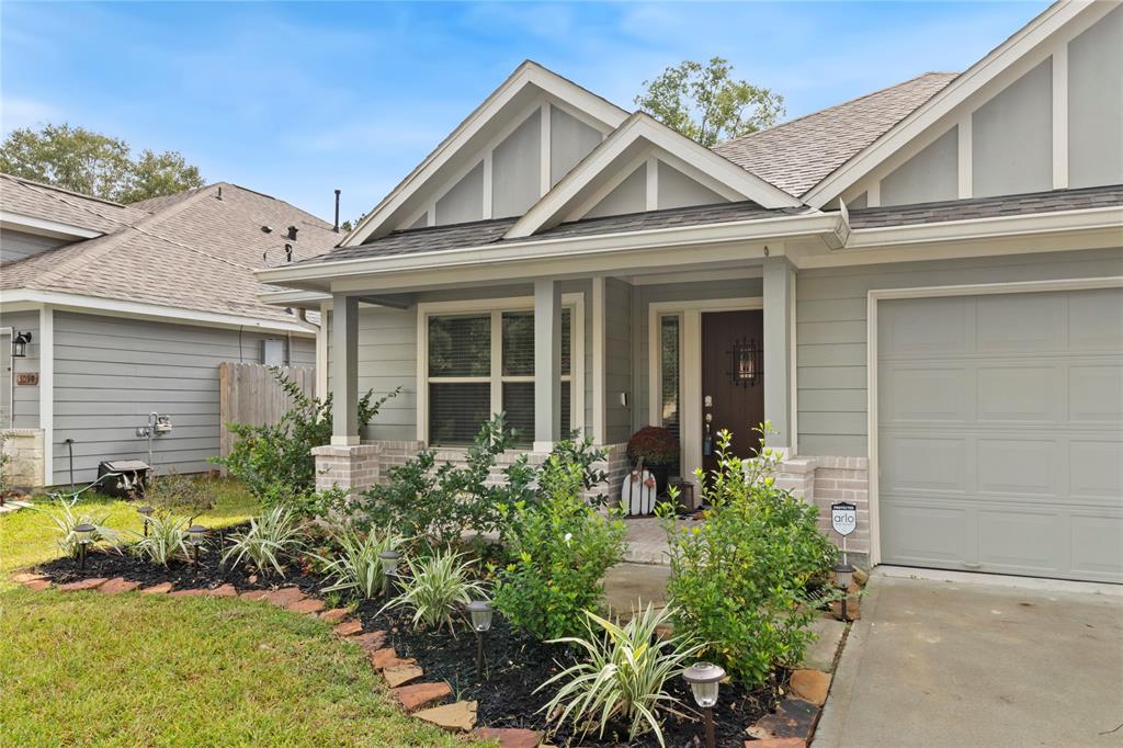 front view of a house with potted plants