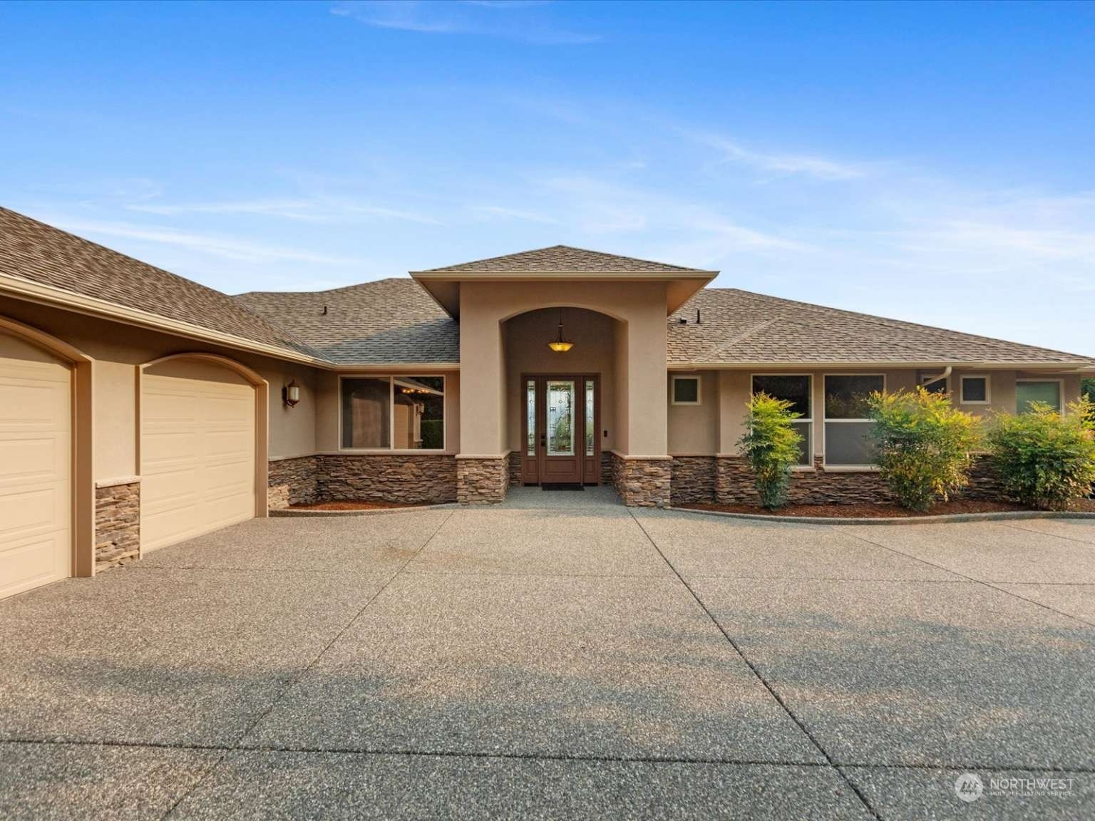 a front view of a house with garden