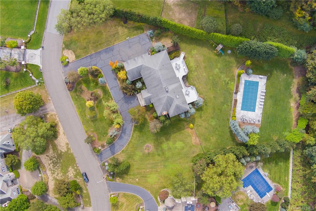 an aerial view of residential house with swimming pool