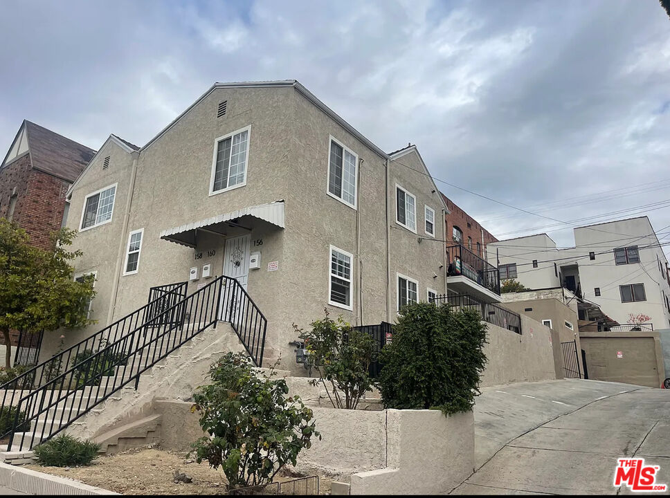 a front view of a house with yard