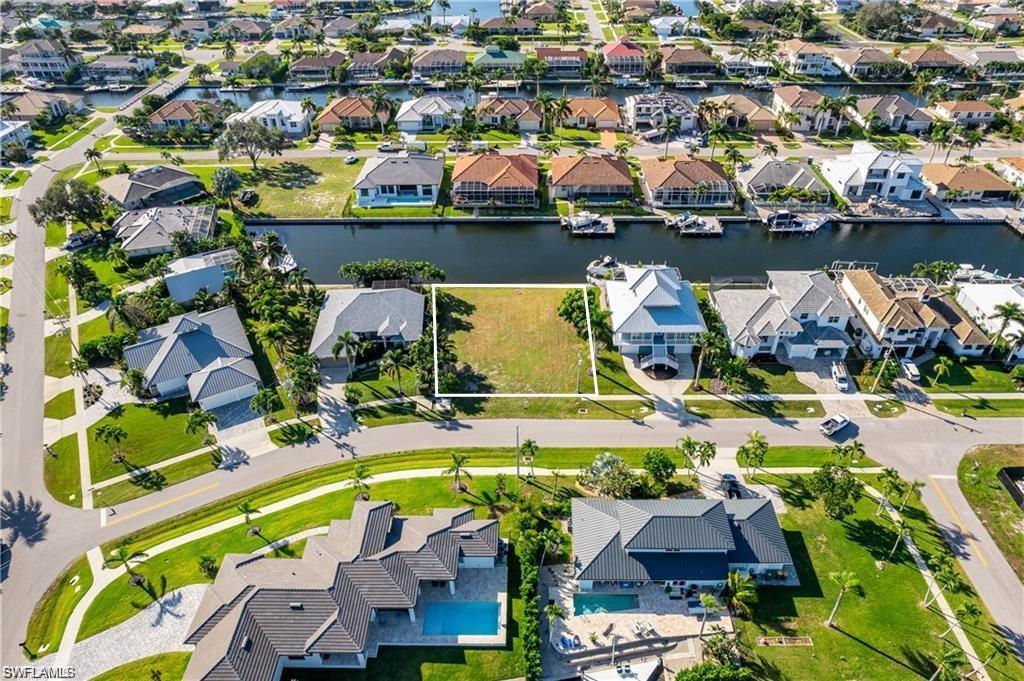 an aerial view of a house with a swimming pool yard and outdoor seating