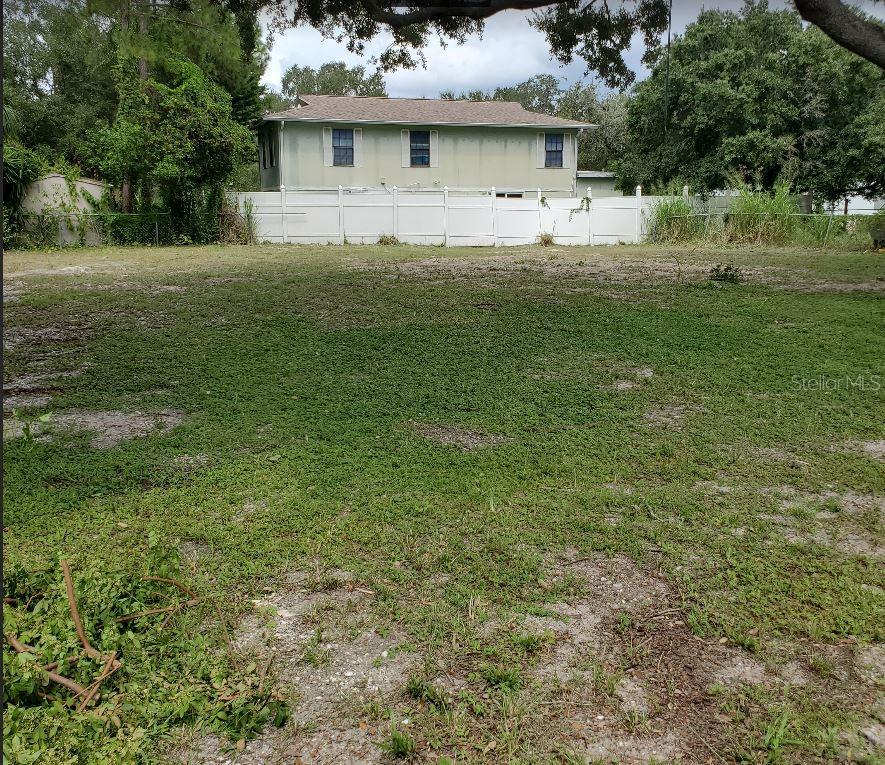 a front view of house with yard and trees