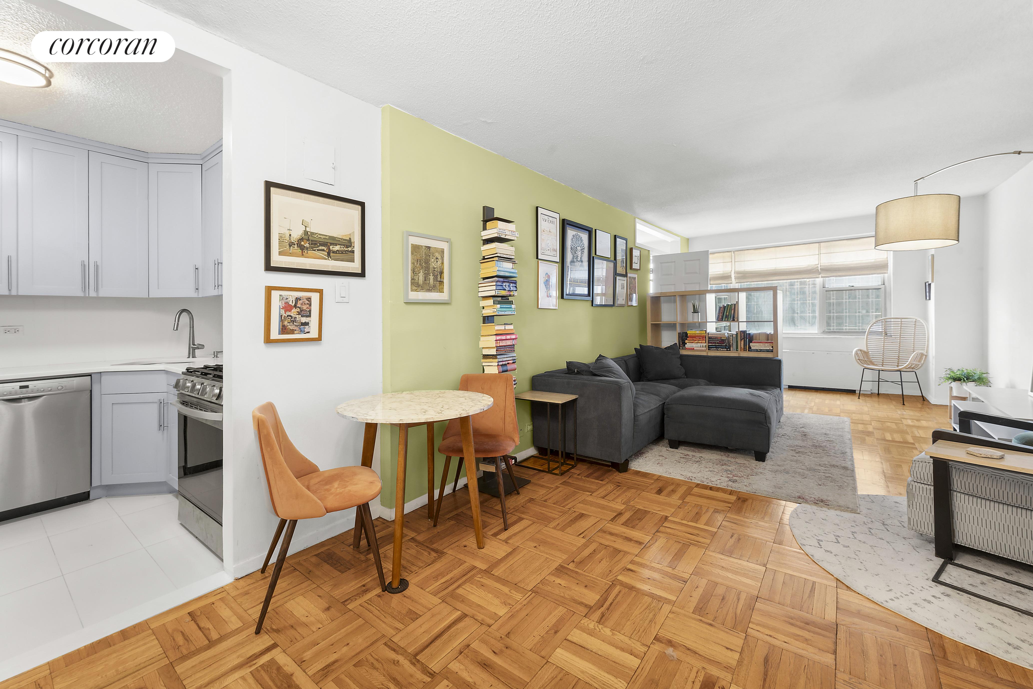 a living room with furniture a couch and a stove top oven