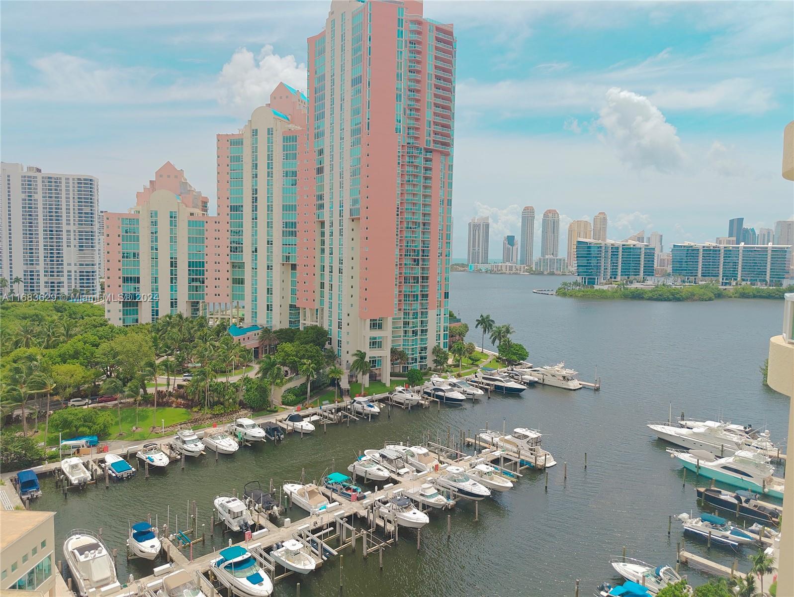 a view of a lake with tall building