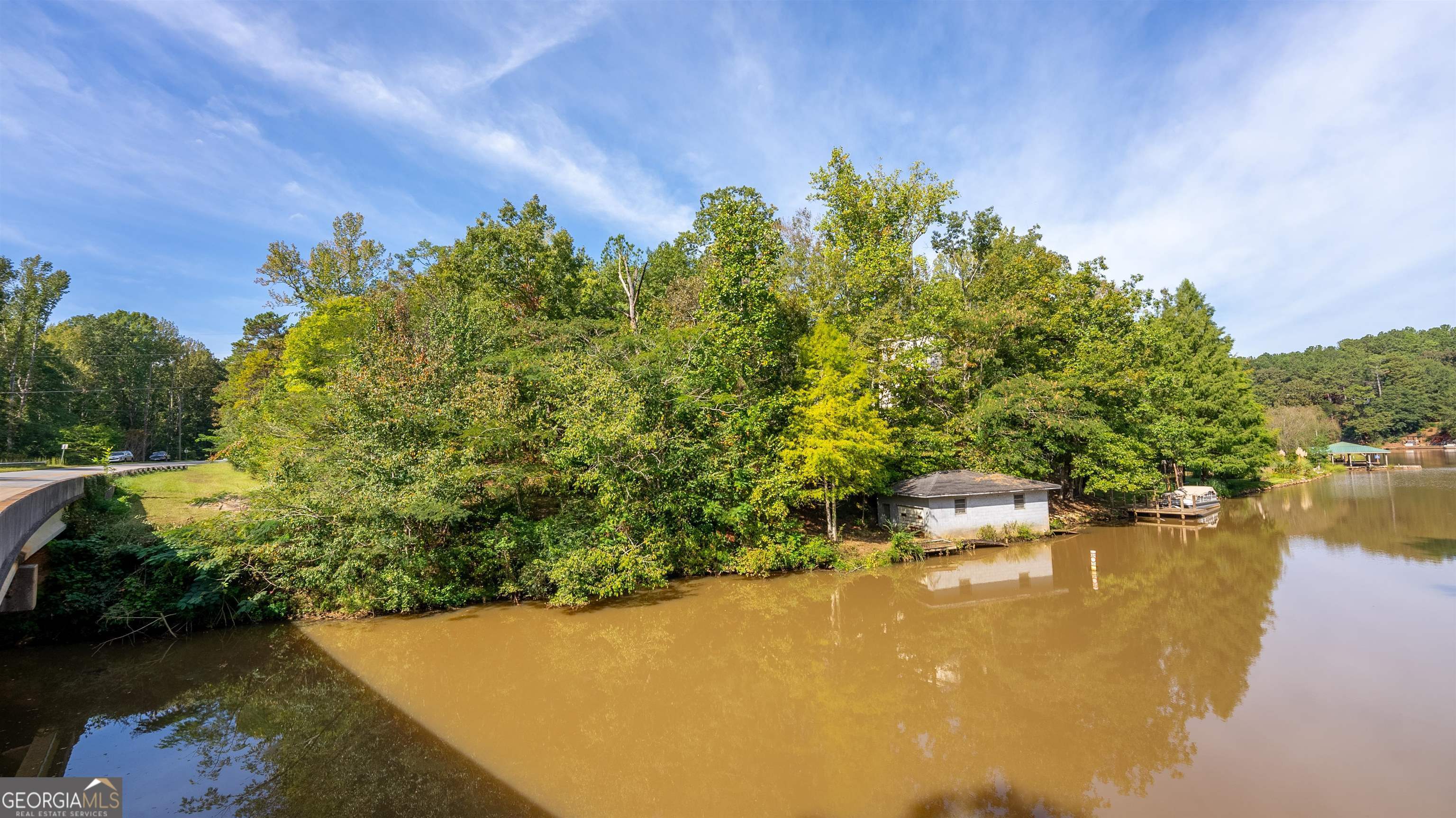 a view of a lake with a yard