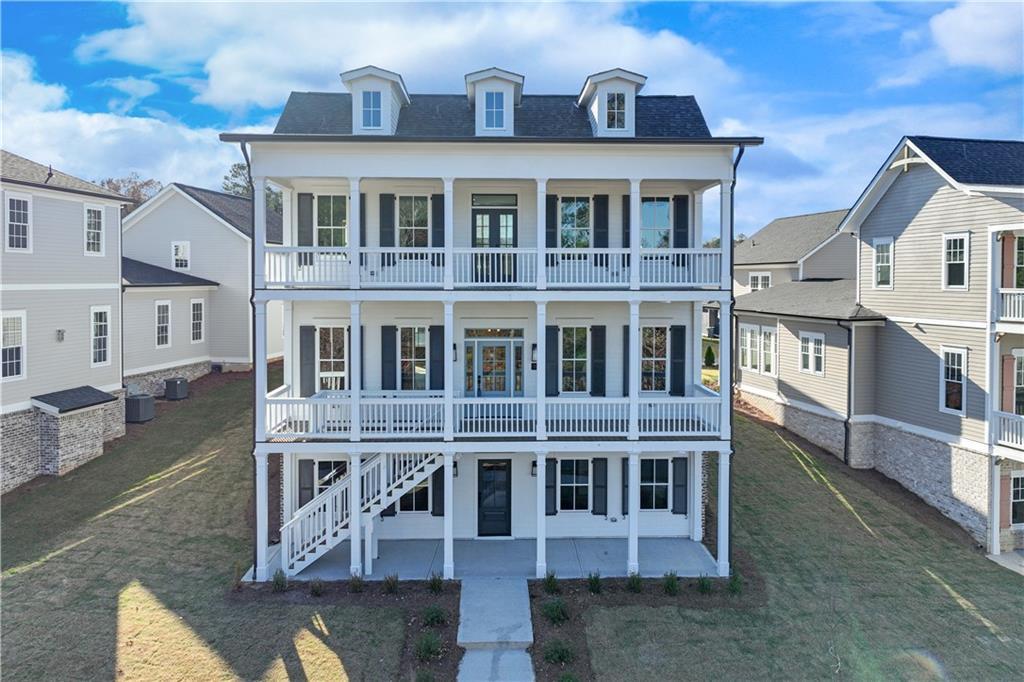 a front view of a residential apartment building with a yard