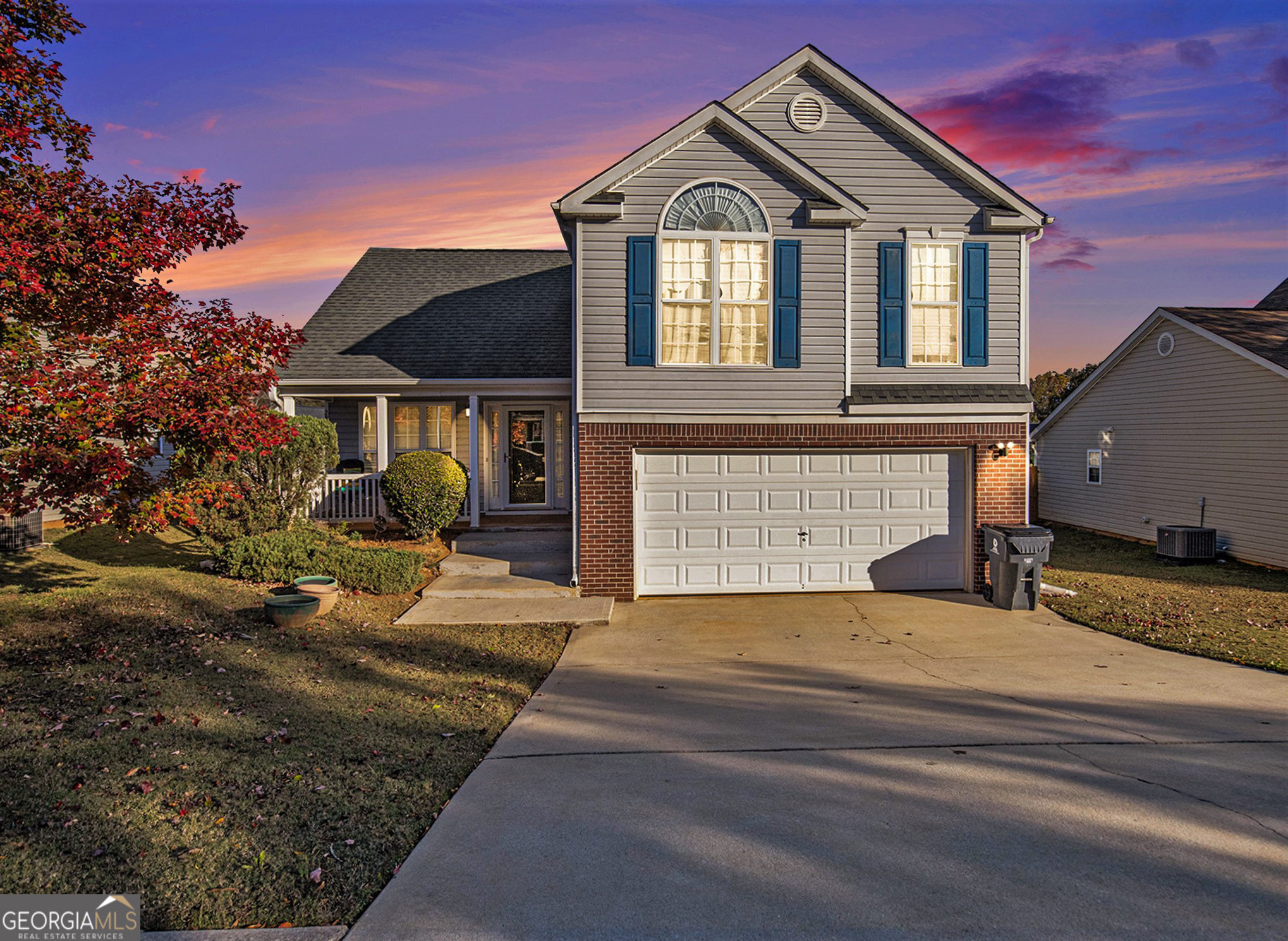 a front view of a house with a yard