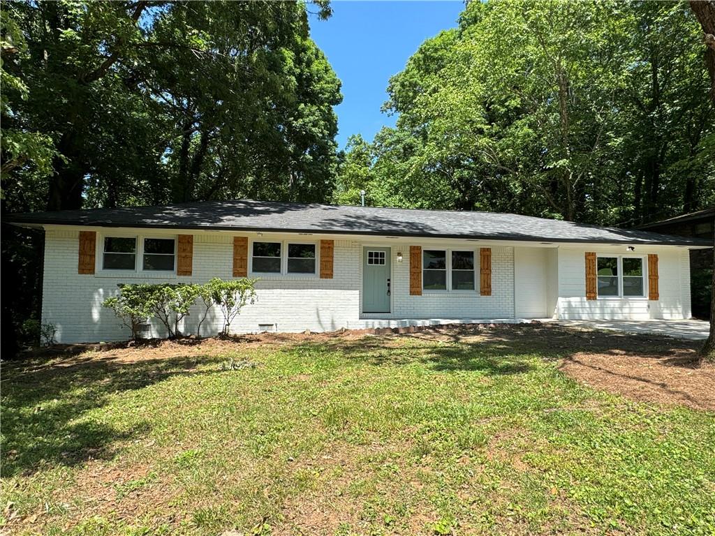 front view of a house with a yard