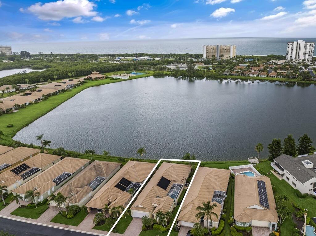 an aerial view of a house with a lake view