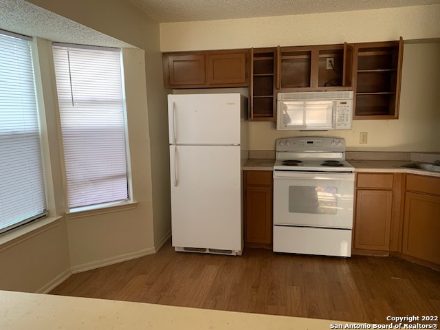 a kitchen with stainless steel appliances a refrigerator and a stove