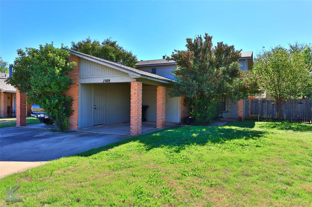 a view of a backyard with a house