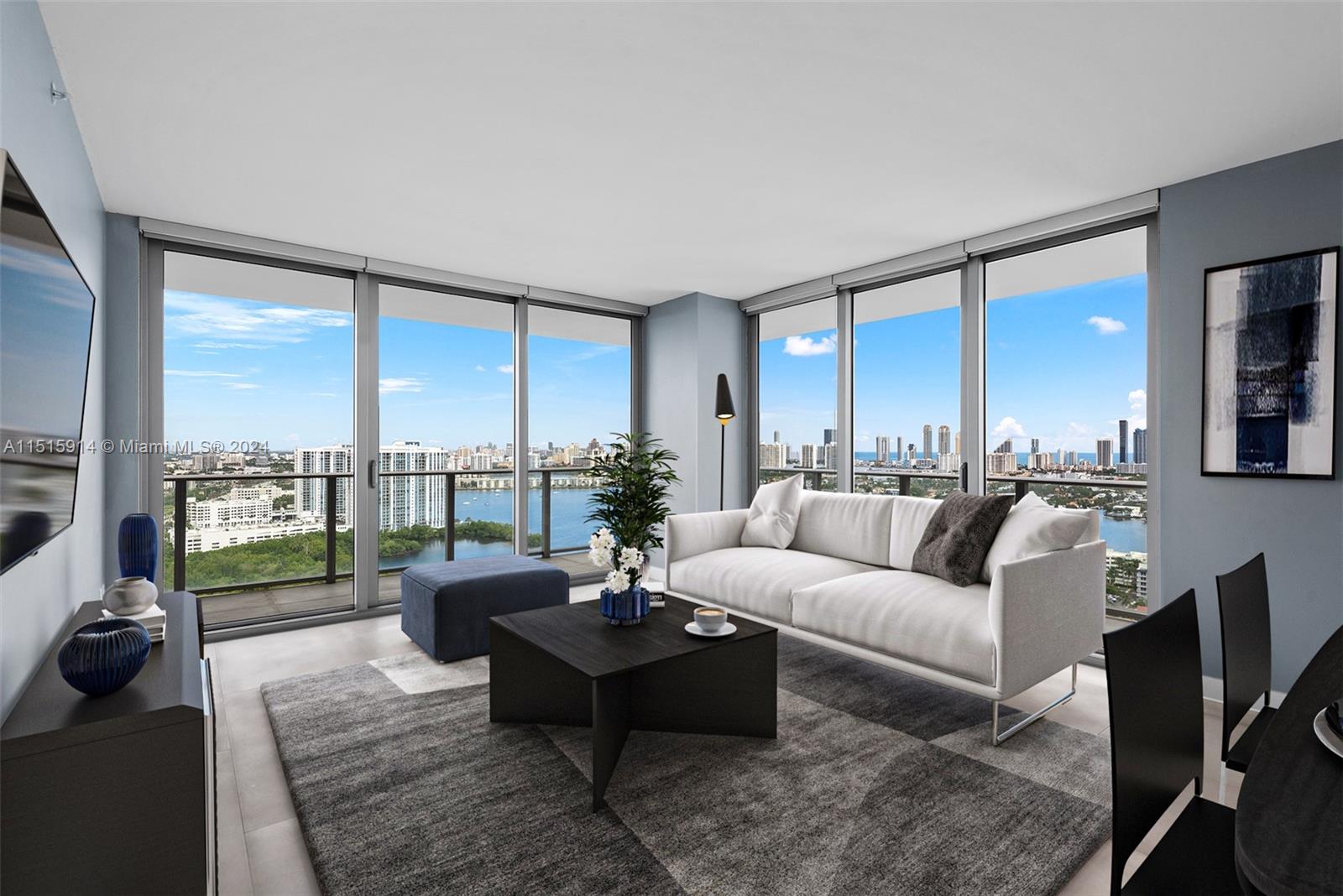 a living room with furniture and a floor to ceiling window