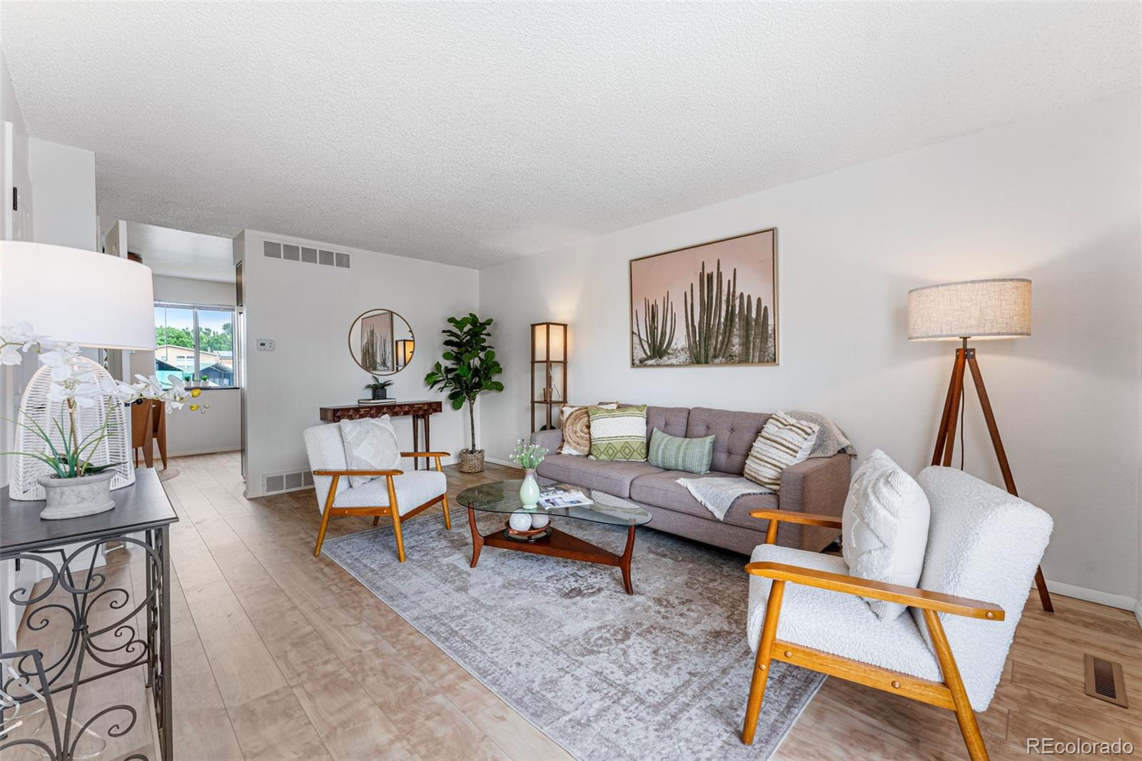 a living room with furniture and a table